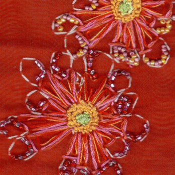 hand embroidered red fabric close up
